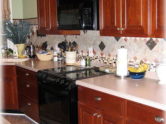 Updated kitchen with cherry cabinets