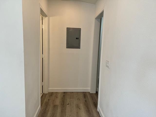 Hallway leading to bedroom and bathrooms