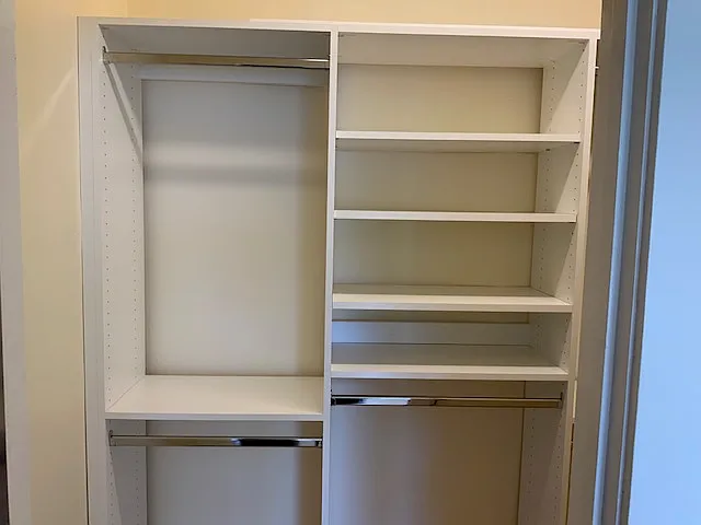 Large bedroom closet with built-in system