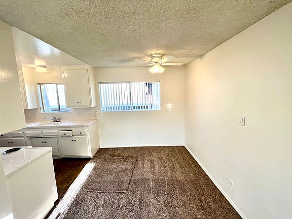 Large dining room with ceiling fan