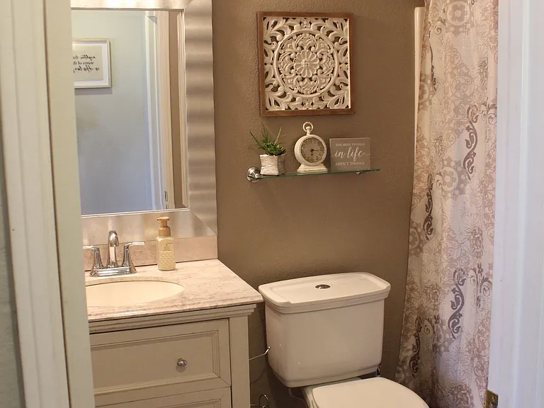 Full bathroom with vanity and shower/tub combo