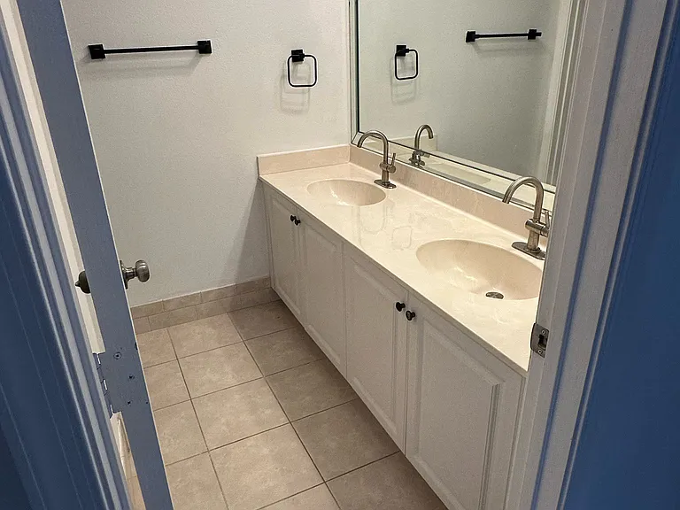 Upstairs bathroom double sink, split bathroom. Shower and toilet are separated.