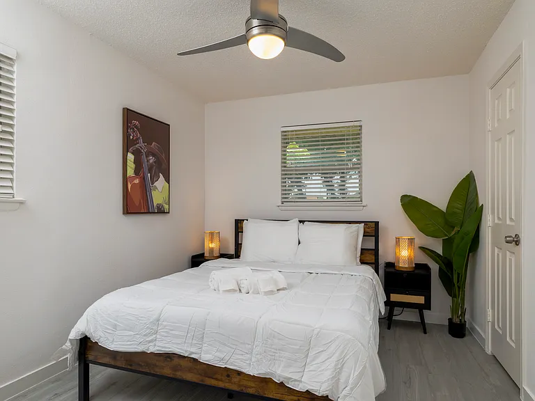 Bedroom #1 with attached full bath and queen bed.