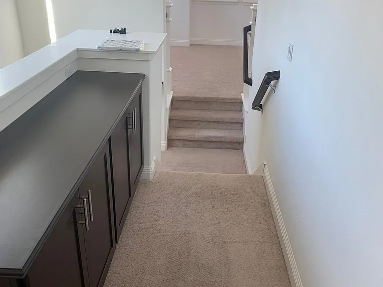 Upstairs hallway linens storage cabinet