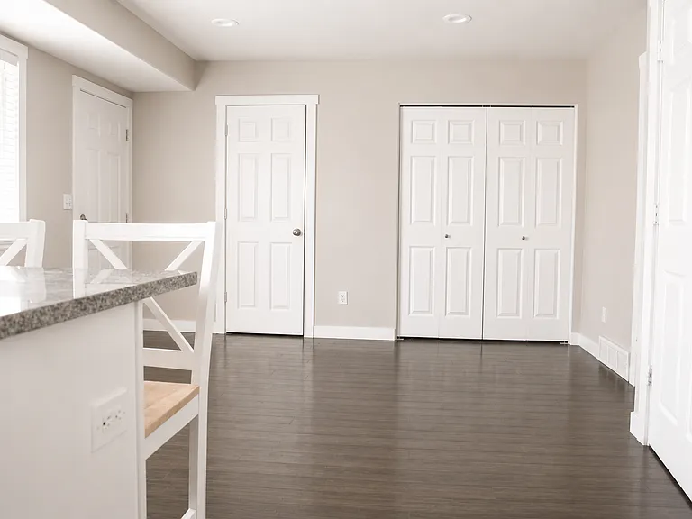 Patio entrance by window, 1/2 bath entrance left, laundry closet center, garage entrance right, basement entrance right