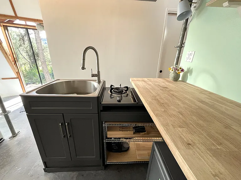 Built-in biogas burner with exhaust hood.
