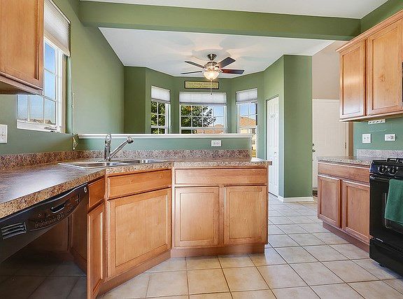 The kitchen is warm and inviting with 42" maple cabinets and a pantry closet....plenty of storage.