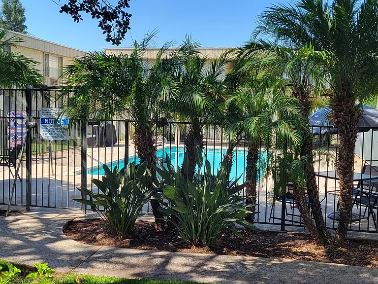 Swimming pool and sun deck at IKARIA Apartments in Santee, California.