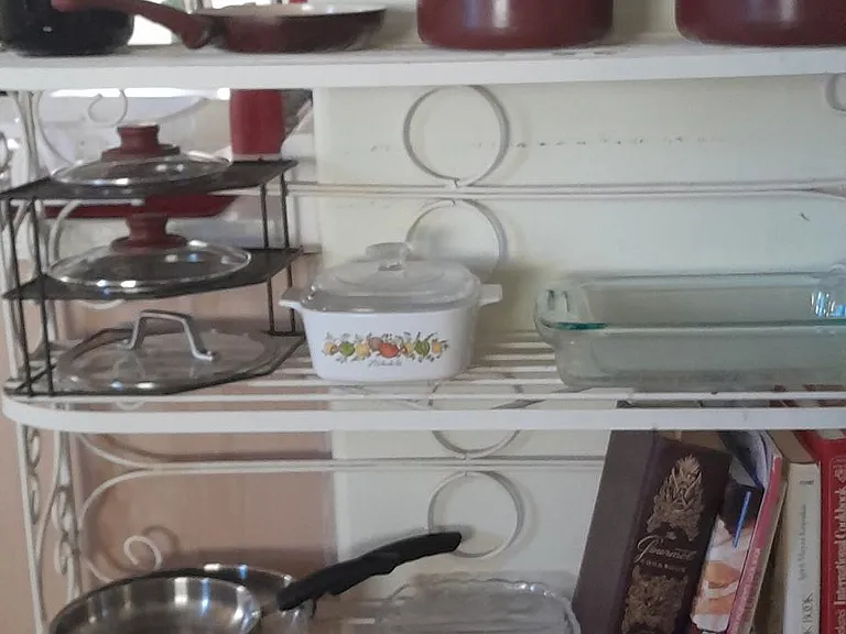 Cookware and cookbooks available for guest use.