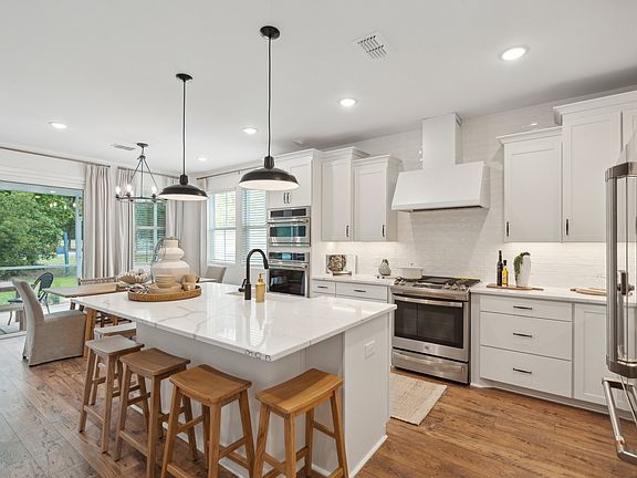 Kitchen with white cabinetry quartz countertop