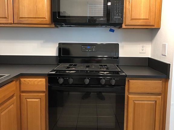 Kitchen: New counters & cabinets, modern stove, built-in microwave with vent & lights