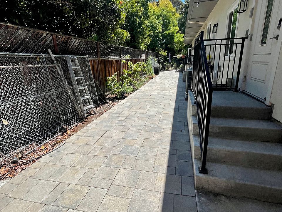 Gated pavement sidewalk (~100 feet long). Shaded and quiet in the afternoon.