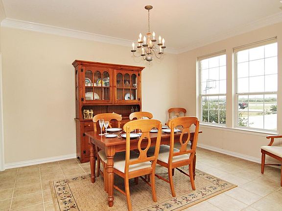 The Formal Dining Room has ceramic tile flooring and crown molding