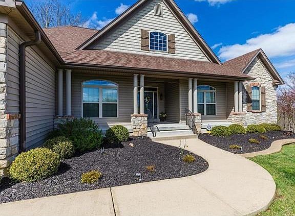 Perfectly manicured landscaping awaits your arrival home.
