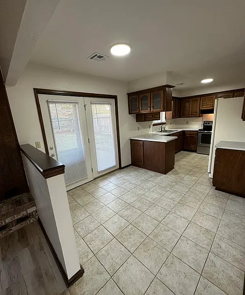 Dining room with patio doors leading to large fenced backyard