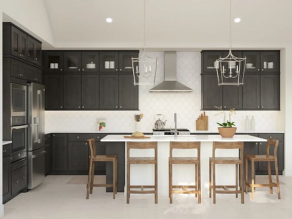 Kitchen with pendant lighting and glass upper cabinets