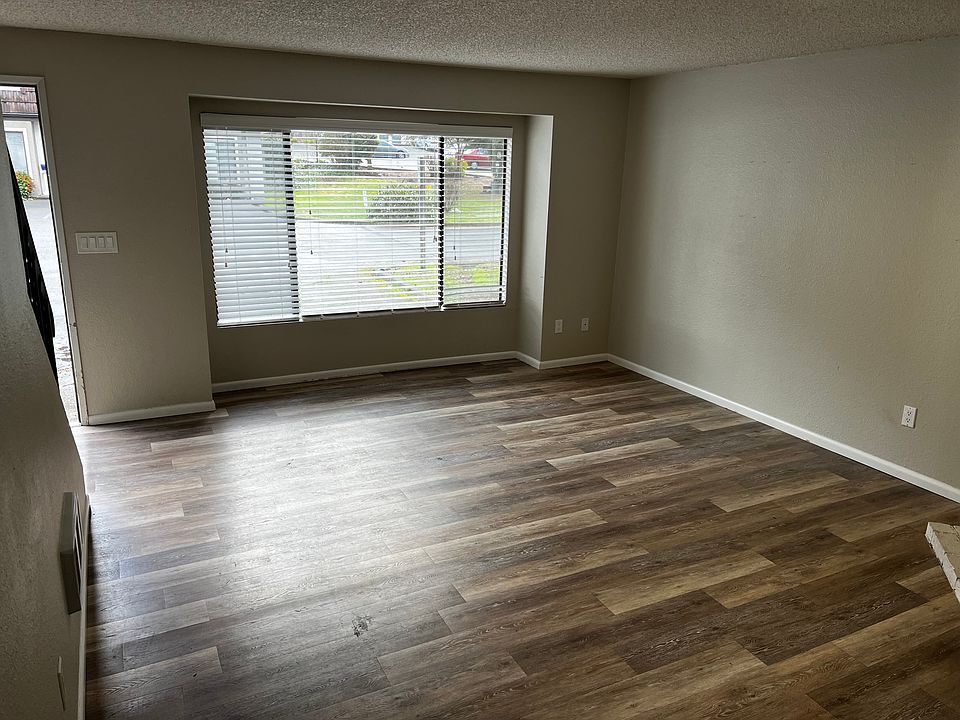 Living room, unit with updated hard wood laminate