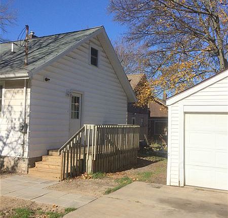 Back entrance with garage