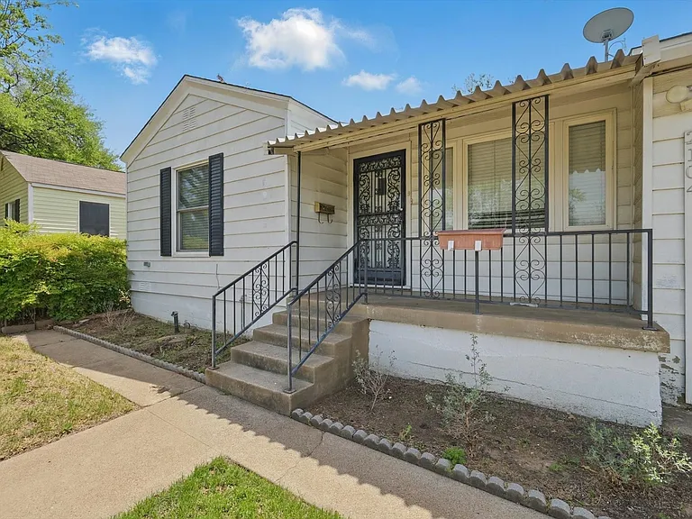 The quaint covered front porch is perfect for morning coffee or relaxing evenings