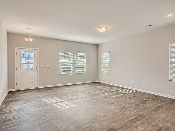 Luxury vinyl plank flooring throughout main areas.