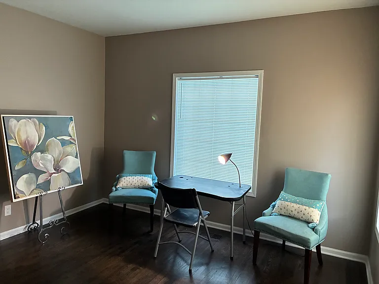 Living room with wood flooring.