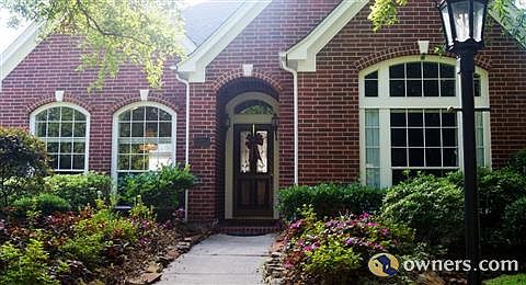 Gaslit lantern adds so much charm to this 4 sided brick home!