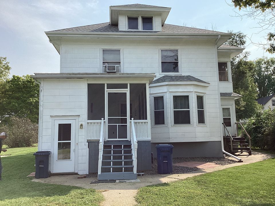 Outside of house, apartment is in the basement, door on the left. Second exit on the right.