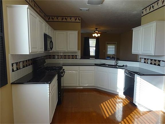 Beautiful Custom Cabinets and New Granite Countertops / New Sink and Fixtures