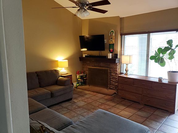 Living room with gas fireplace and large TV mount