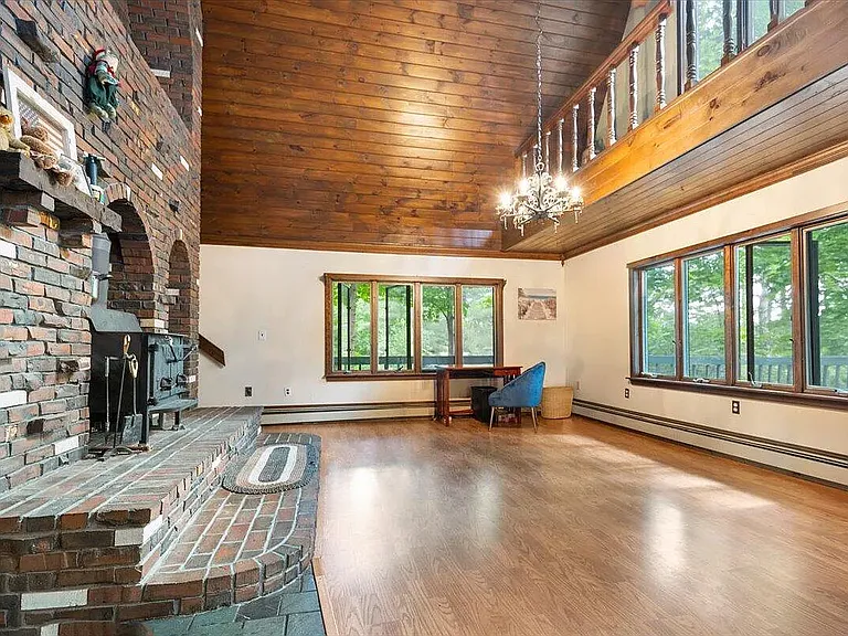 living room with 3 story fireplace