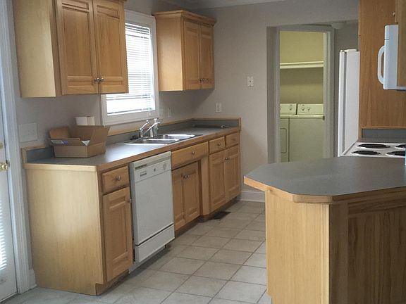 View from Breakfast Nook of Kitchen and Laundry Room with Pantry area.