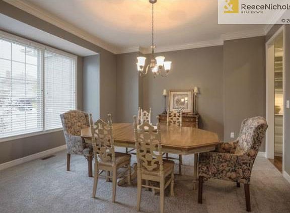 Large formal dining with fresh paint and carpet