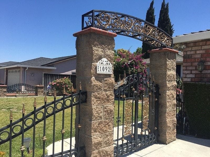 Front yard with nice welcoming entry gate