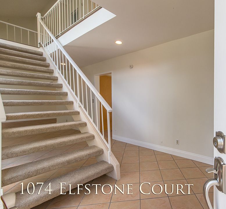 Front open to entry of 1074 Elfstone Court, Westlake Village, CA 91361. With a view of the wide staircase leading to the second floor area of the property.