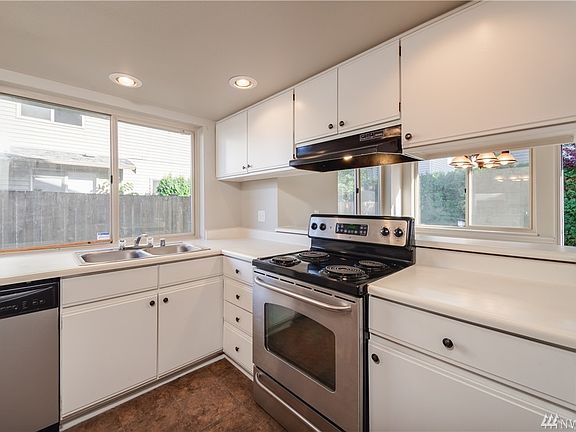 Another view of the kitchen area; there are excellent storage cabinets and accessibility, and a stainless dual sink.