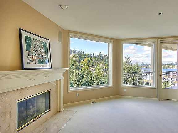 Large picture windows looking toward the Bay and Seattle skyline.