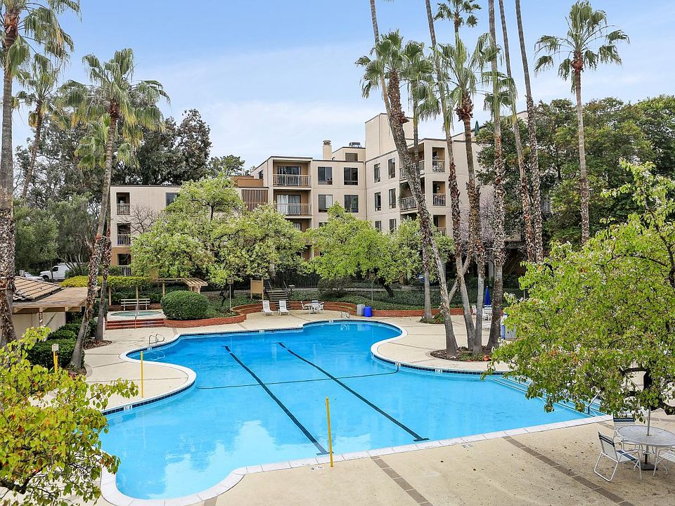 Resort-style living, walking distance to downtown. Year-round heated pool and hot tub.