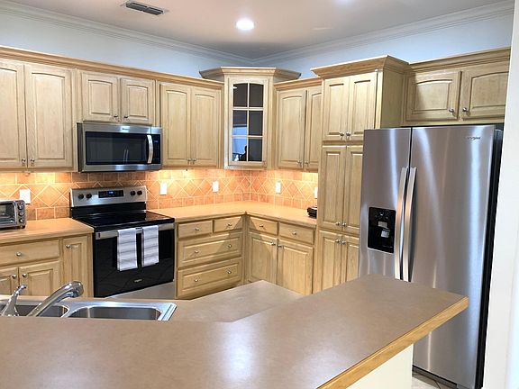 Updated stainless steel appliances and lots of cabinets.