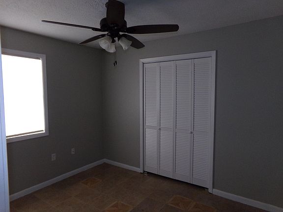 Bedroom with shelves in the walk in closet