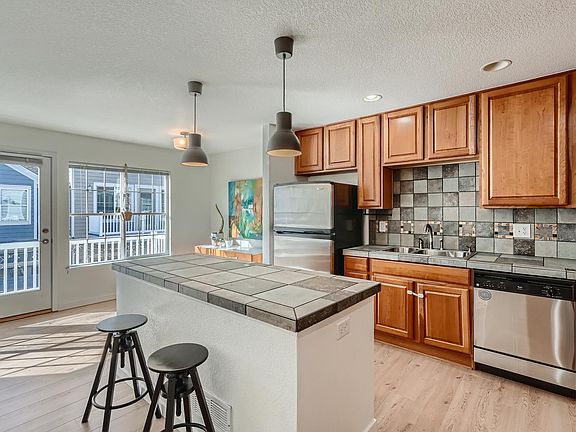 Kitchen w/ stainless steel appliances and cabinets for days!