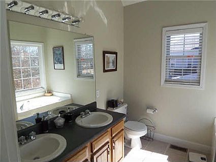 Three full baths with ceramic tile floors.