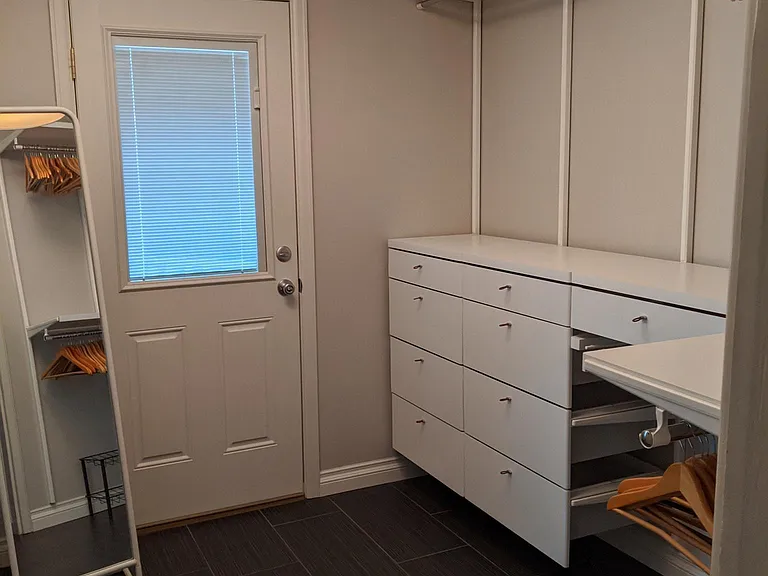 Walk in closet with access to 2nd floor deck.