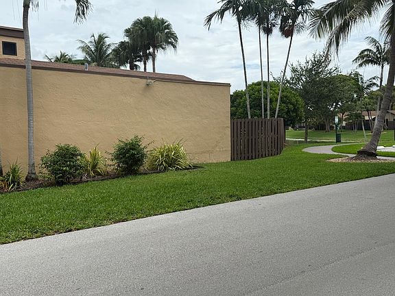 Private backyard lakefront has privacy with a wooden fence