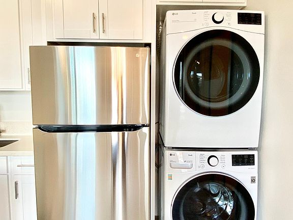 LG Stainless Steel Refrigerator and LG Washer/Dryer (Both are Full Size)