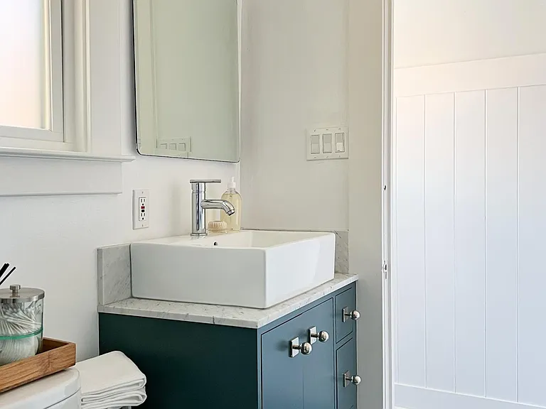Back bathroom (across the hall from the Garden Bedroom); this bath has a stall shower and custom single vanity.