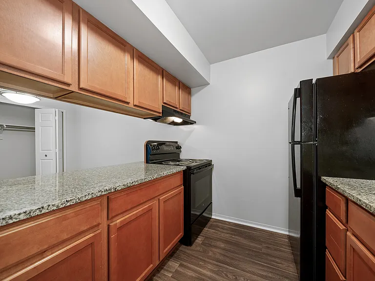 Efficient and cozy kitchen at Woodland Villa Apartments in Westland, MI.