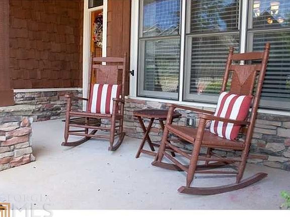 Lovely Rocking chair front porch. Makes this home feel warm and inviting!