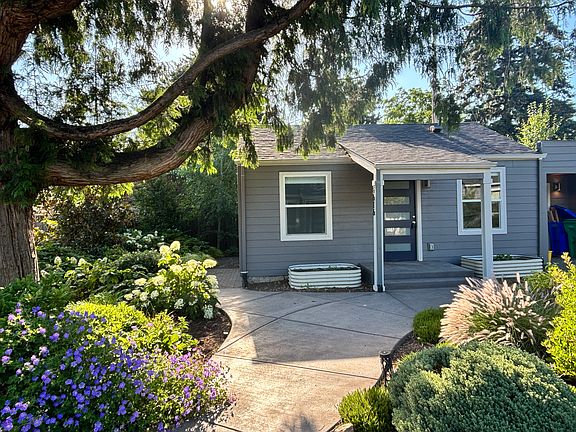 Front door, patio to left, garage to right