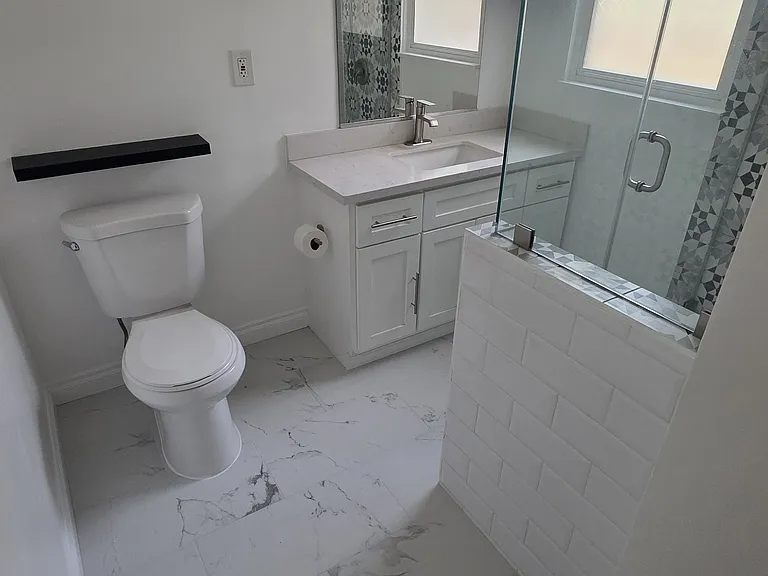 Remodeled bathroom with new floor tile