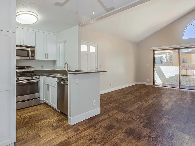 Spacious kitchens with wood flooring throughout